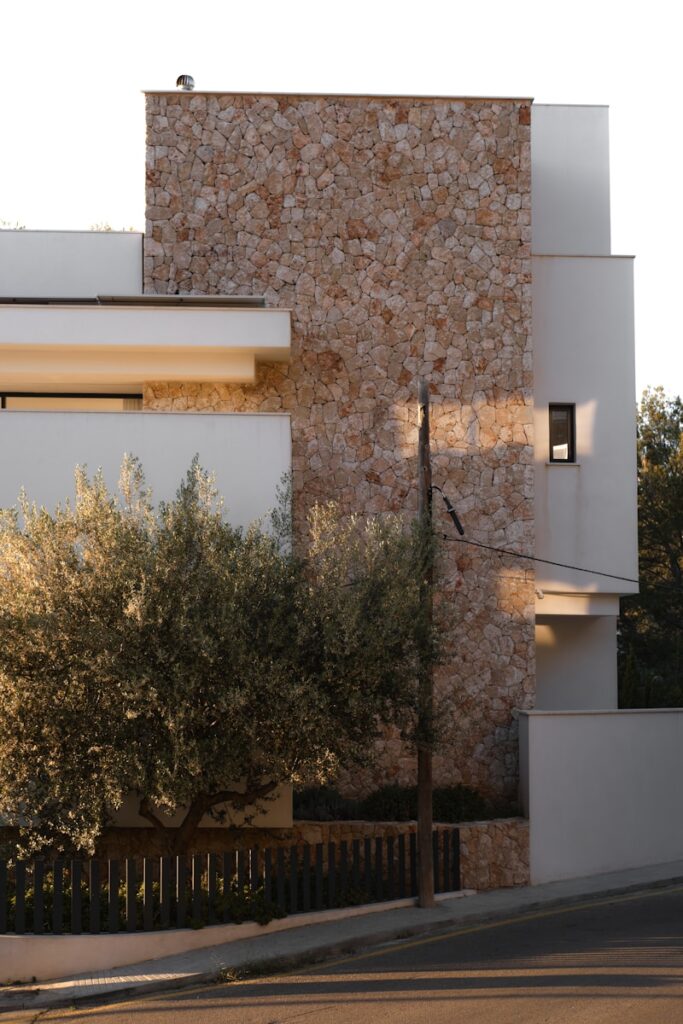 Modern building with stone and white facade.